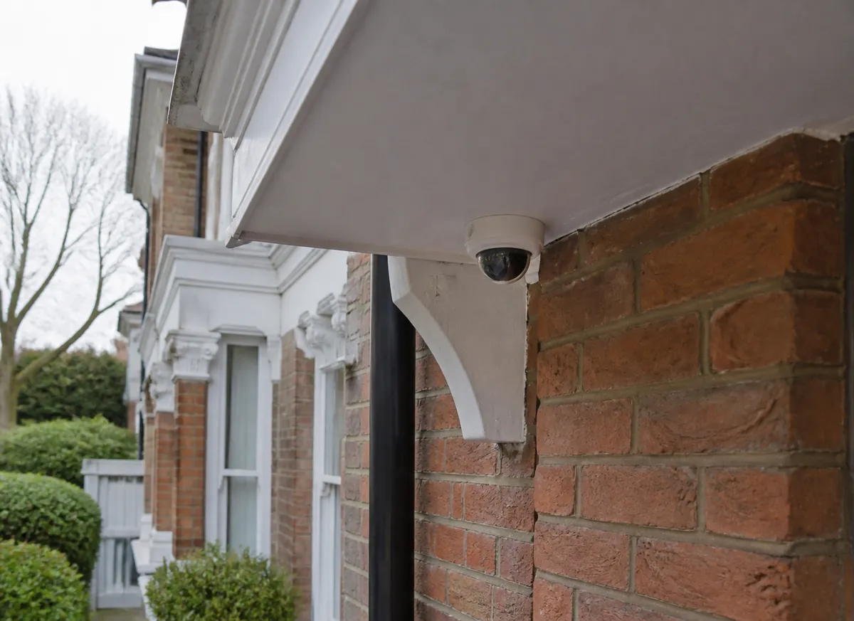 Discreet CCTV camera fitted beneath the soffit of a home in Crouch End