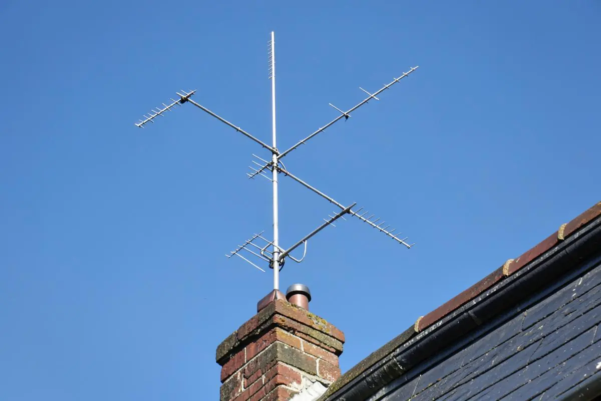 DAB and FM radio aerials fitted to a chimney mast on a London rooftop